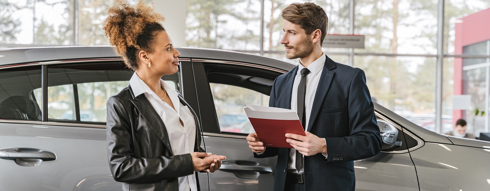 woman buying a car in-person