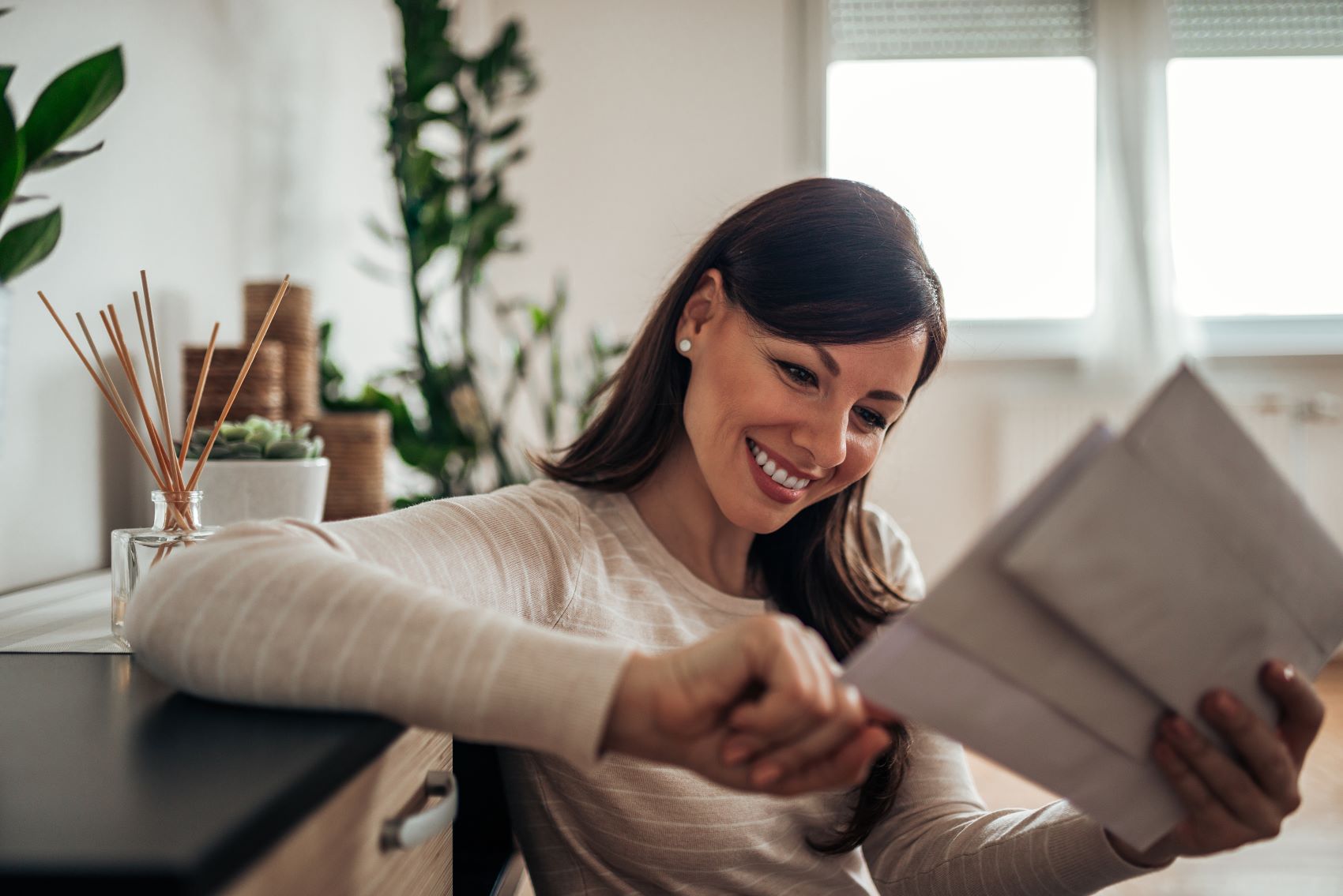 woman reading direct mail