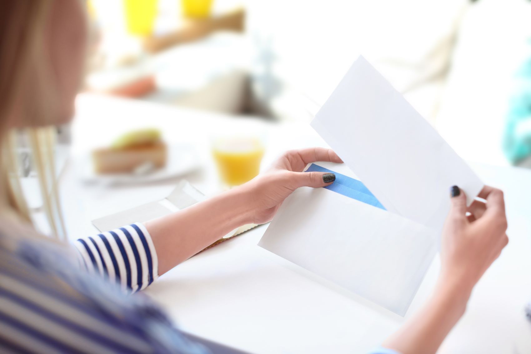 woman sorting through direct mail 