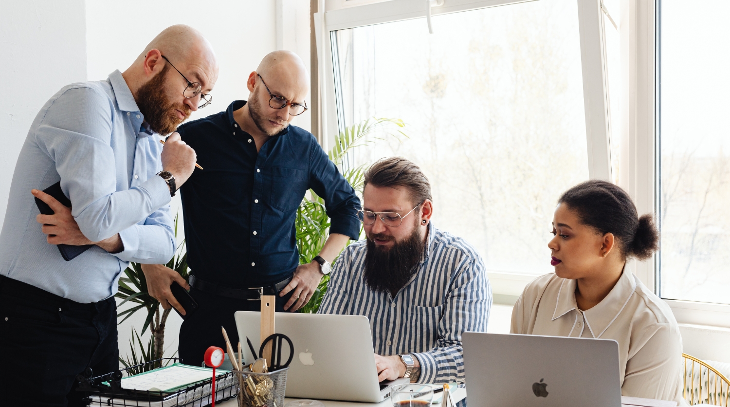 A team of automotive marketing experts collaborating on a strategy session for the CARS digital marketing program.